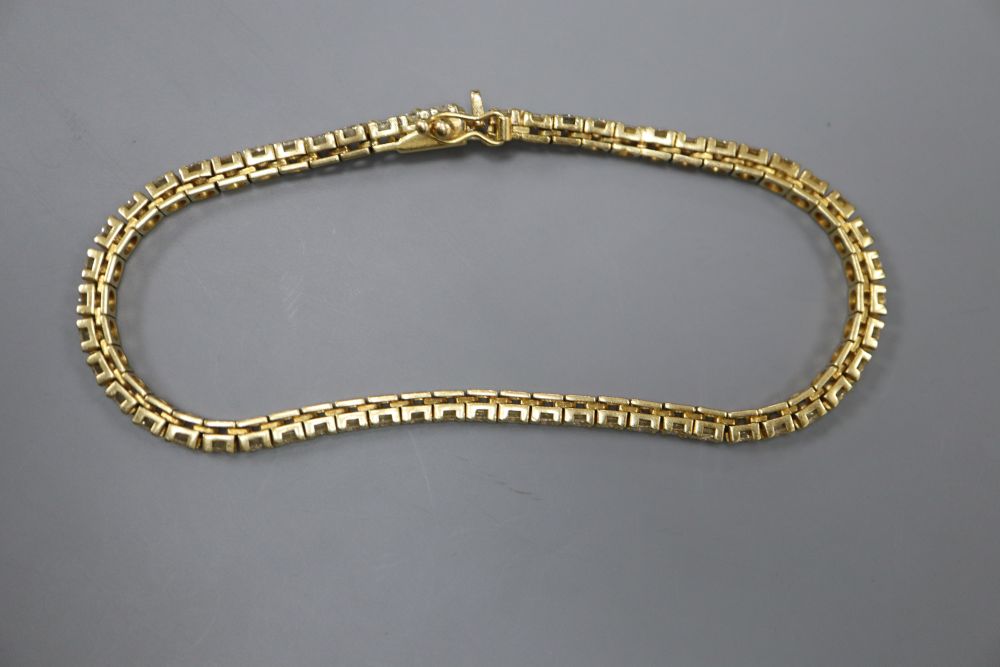 A modern Italian 18ct gold and diamond set line bracelet, 18.8cm, gross 13.7 grams,